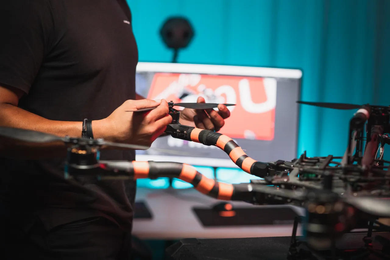 Person handling drone propeller