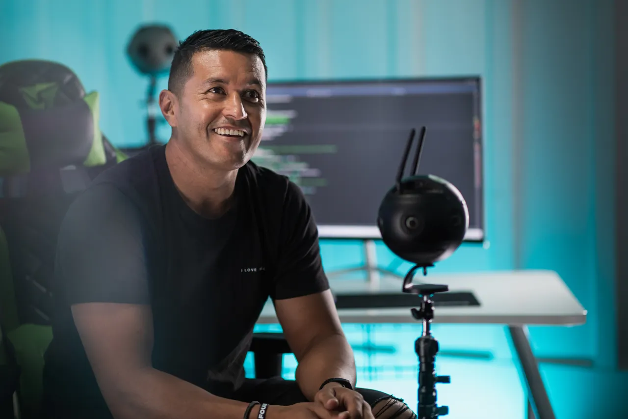 Man sitting next to 360 camera
