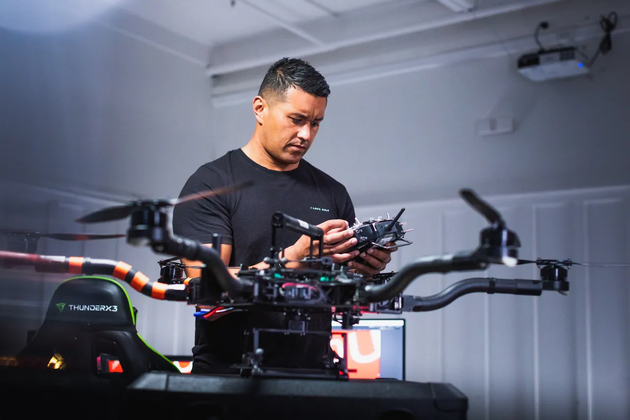 Man setting up drone inside