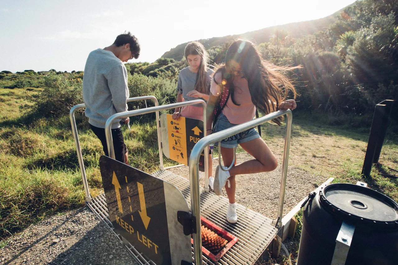 People using hygiene station on walk