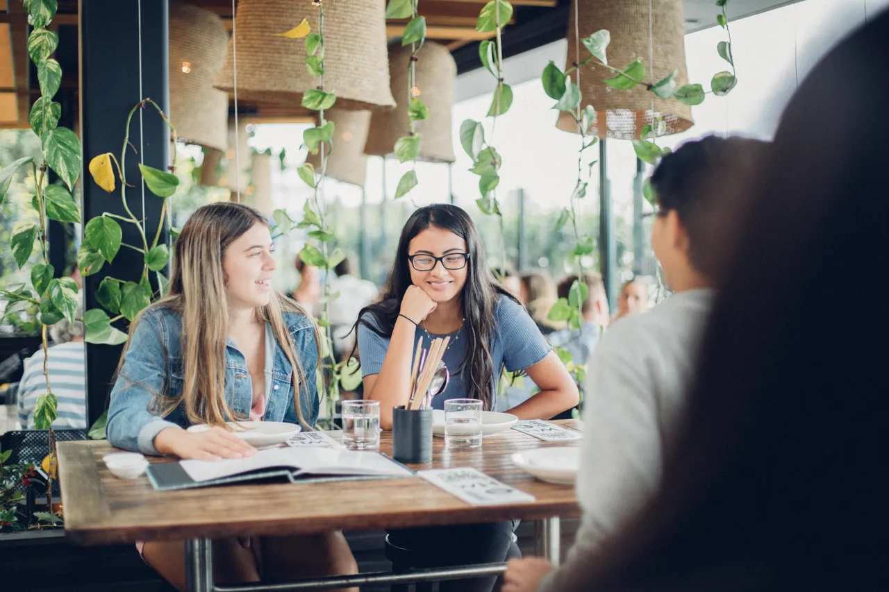 Girls sitting at a restaurant
