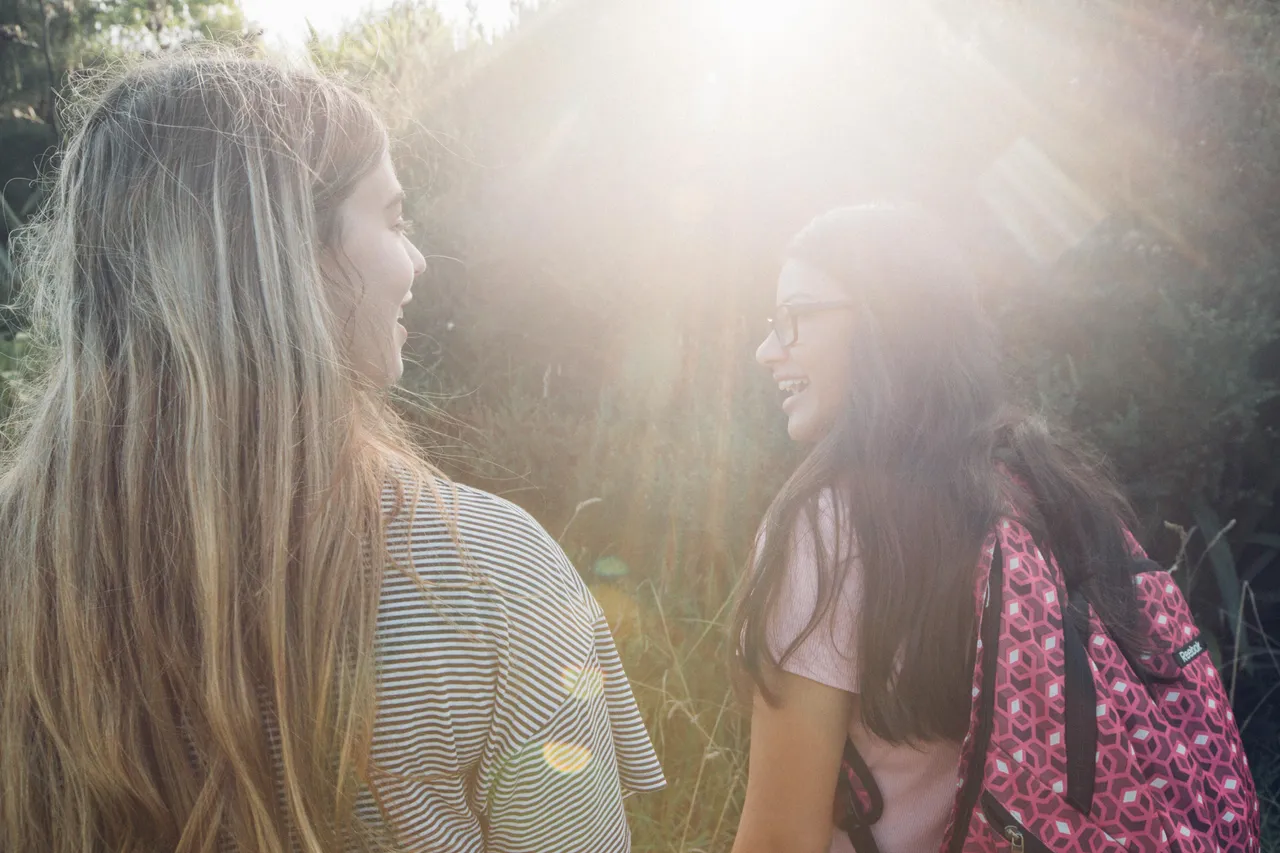Girls walking and interacting with each other in nature