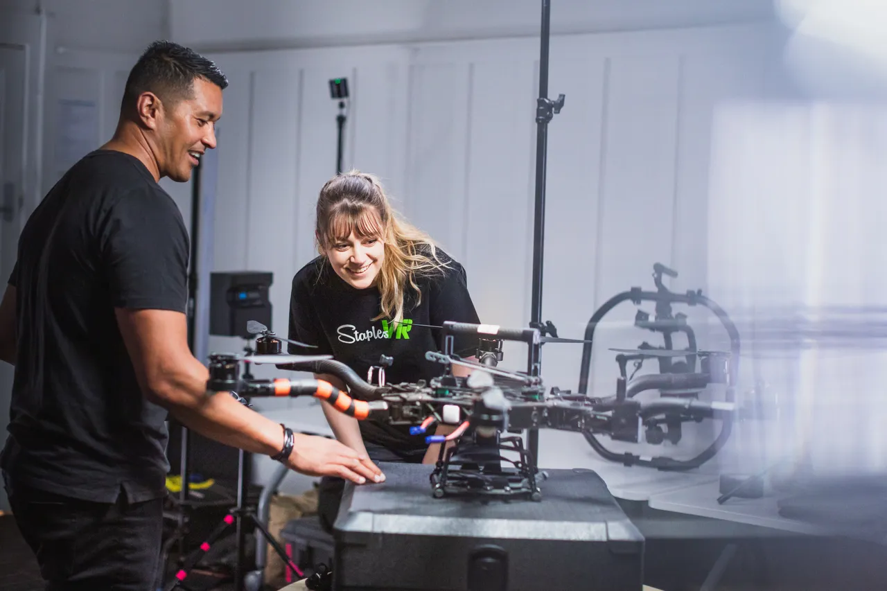 Man and woman discussing drone equipment