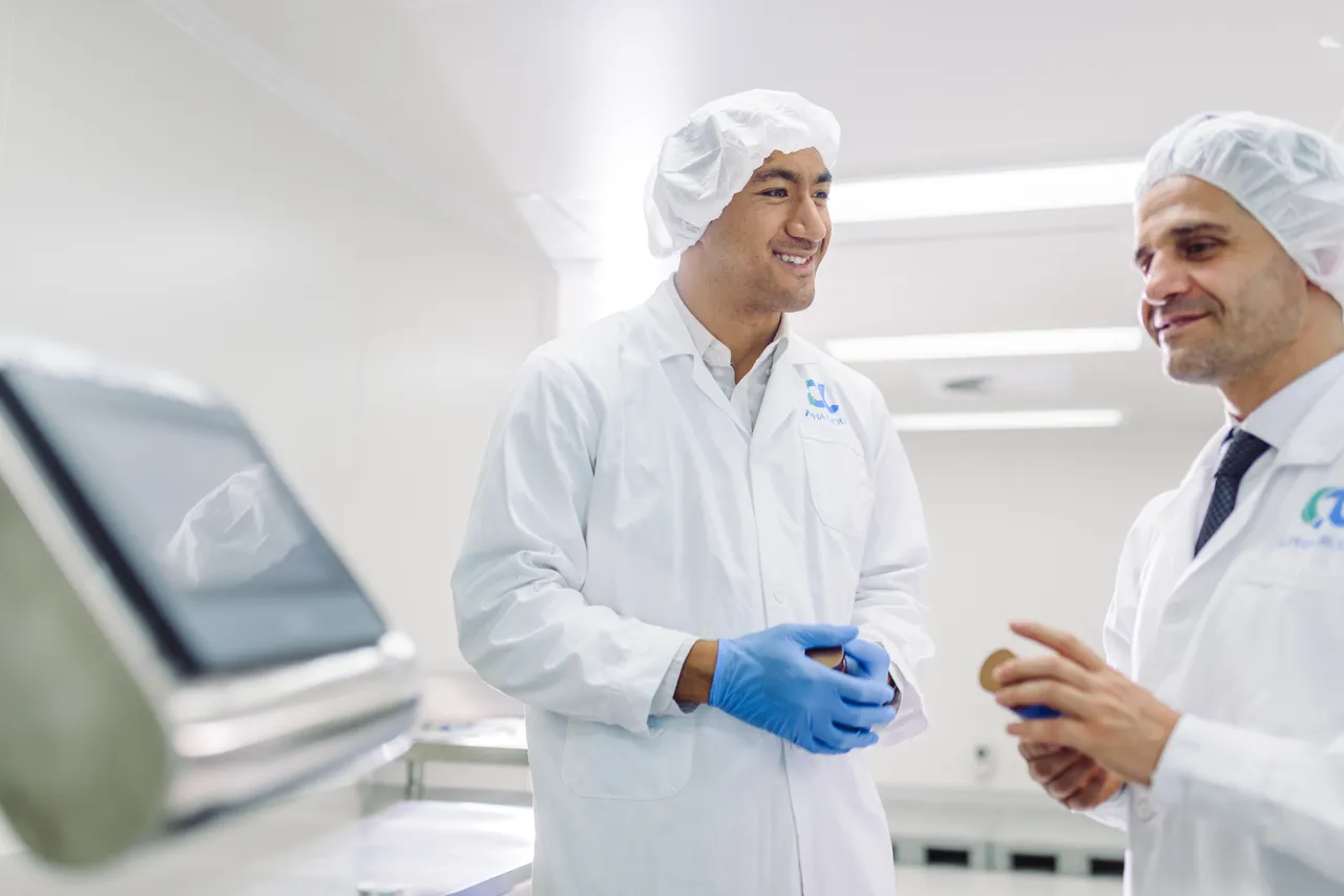 Two men discussing work in laboratory