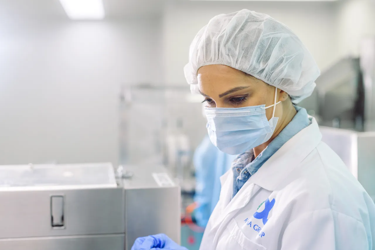 Woman with mask in pharmaceutical company
