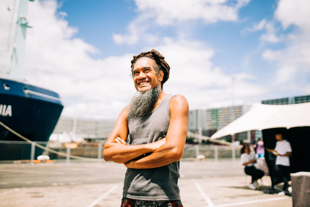 Smiling man with beard on Auckland waterfront