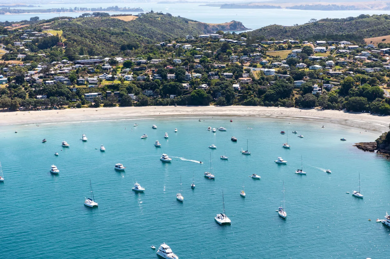 A Waiheke beach and boats in ocean