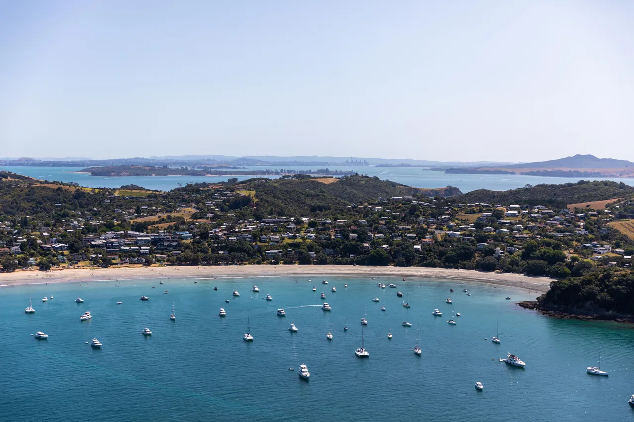 A Waiheke Beach with boats in ocean