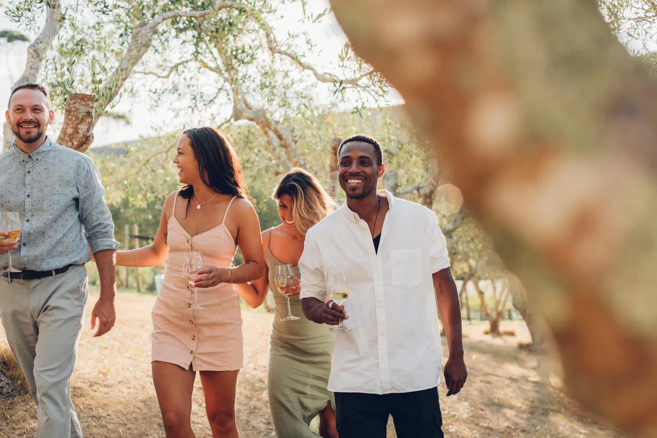 Friends walking through the olive groves at Stonyridge vineyard