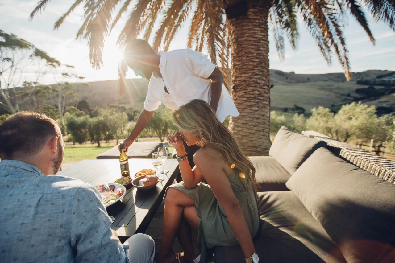 Friends indulge in food and wine at Sunset