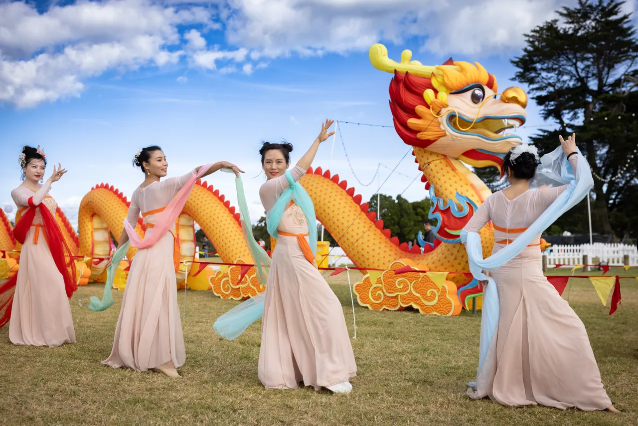 Smiling performers at Auckland Lantern Festival