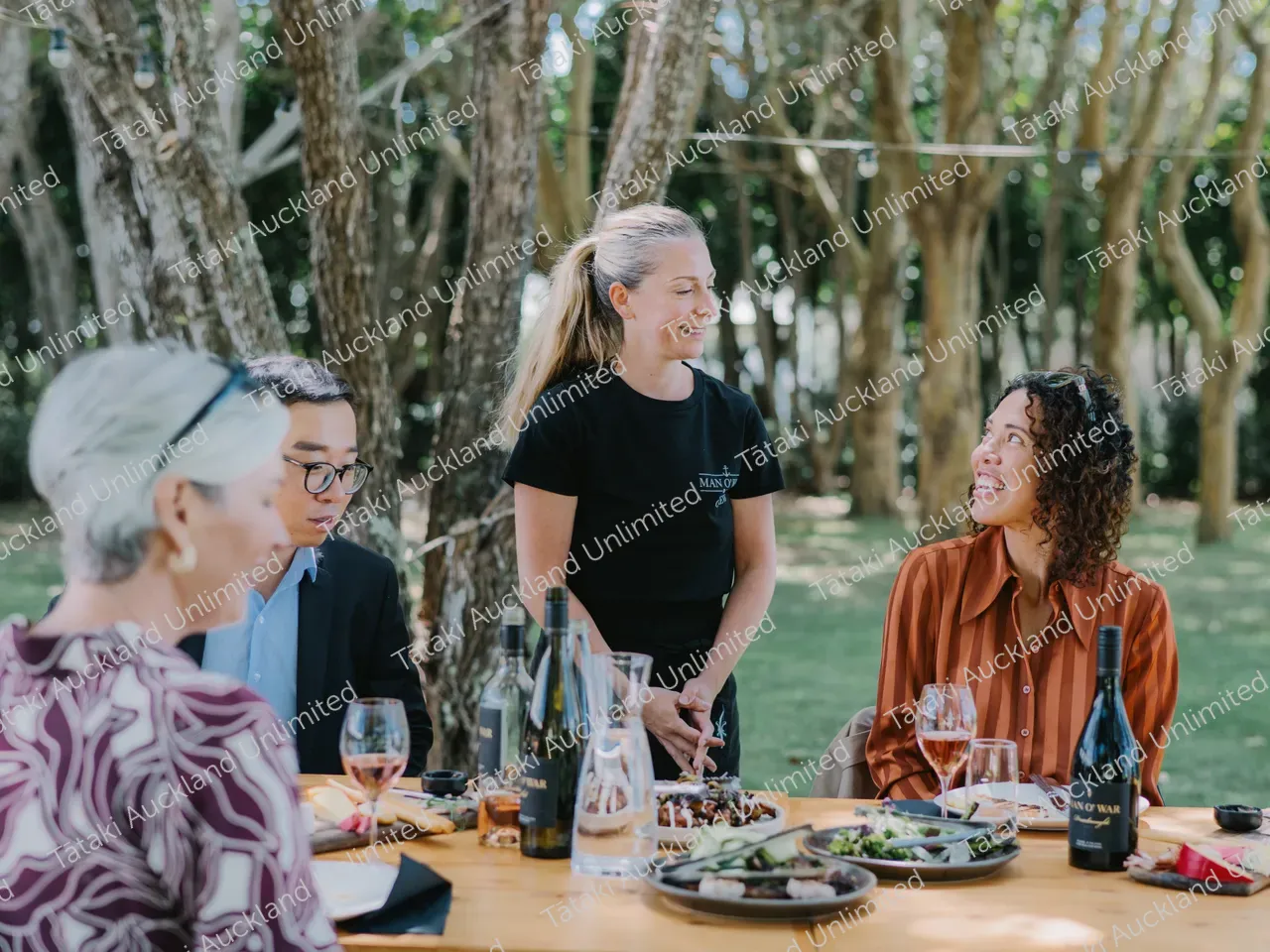 Business professionals dine outdoors at Waiheke vineyard 19