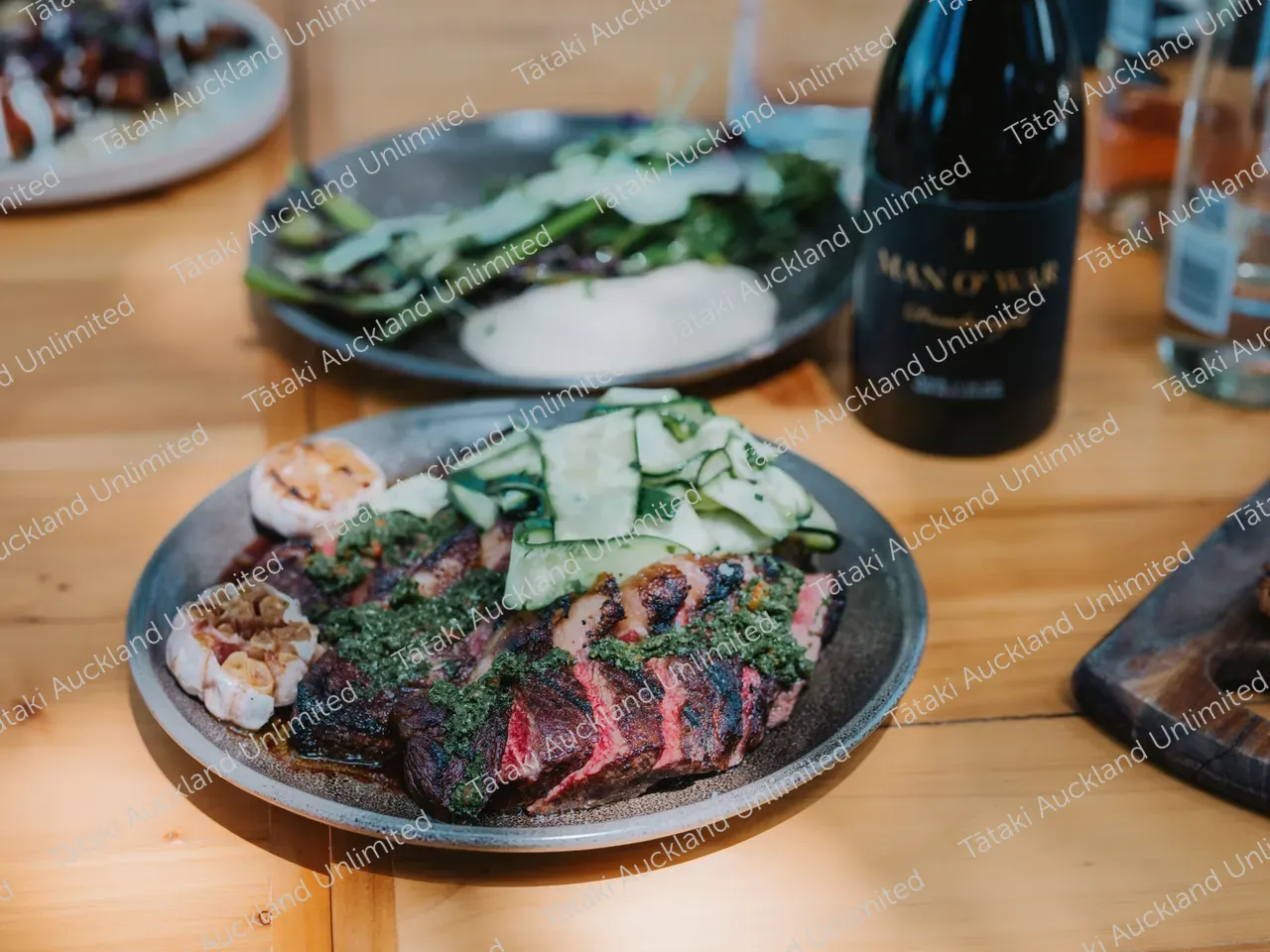 Business professionals dine outdoors at Waiheke vineyard 9