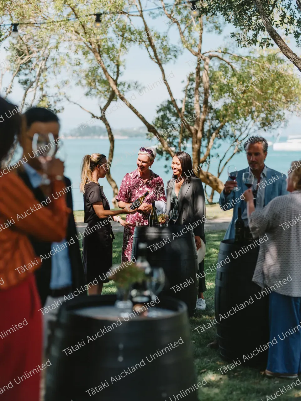  A group of business professionals wine tasting at a Waiheke vineyard 2