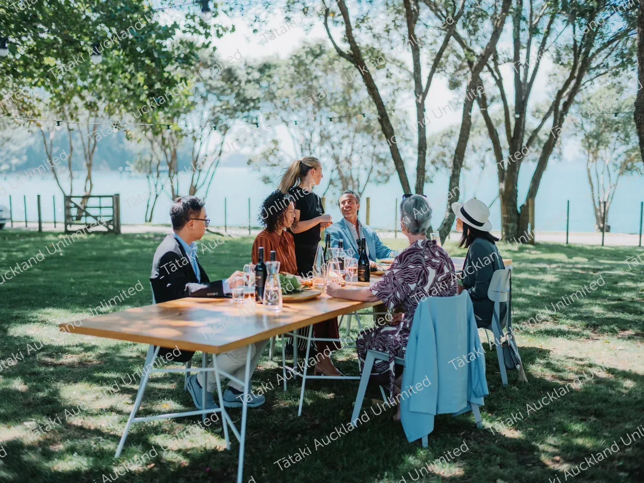 Business professionals dine outdoors at Waiheke vineyard 3