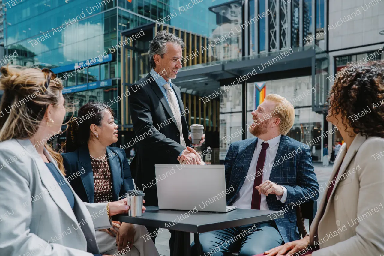 Outdoor business meeting with five professionals