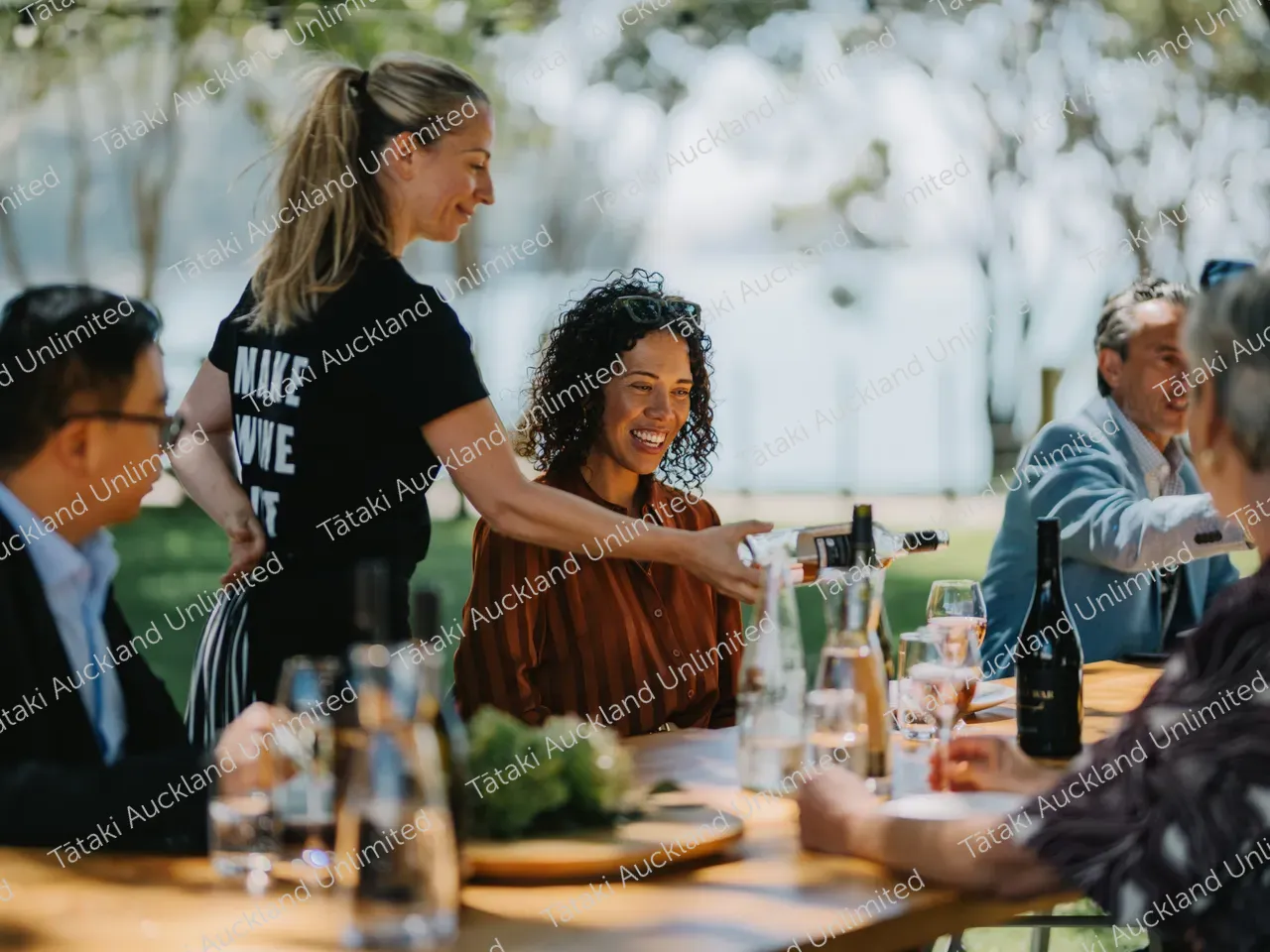 Business professionals dine outdoors at Waiheke vineyard 12
