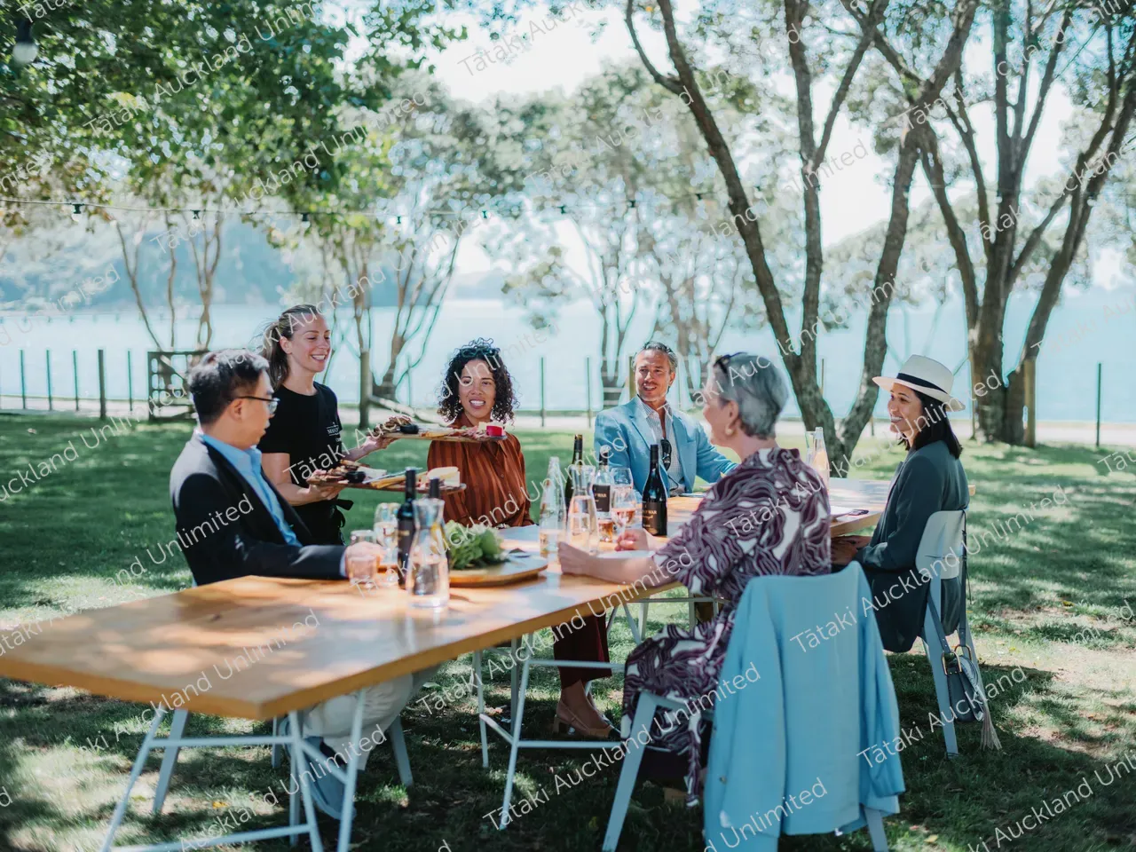 Business professionals dine outdoors at Waiheke vineyard 4