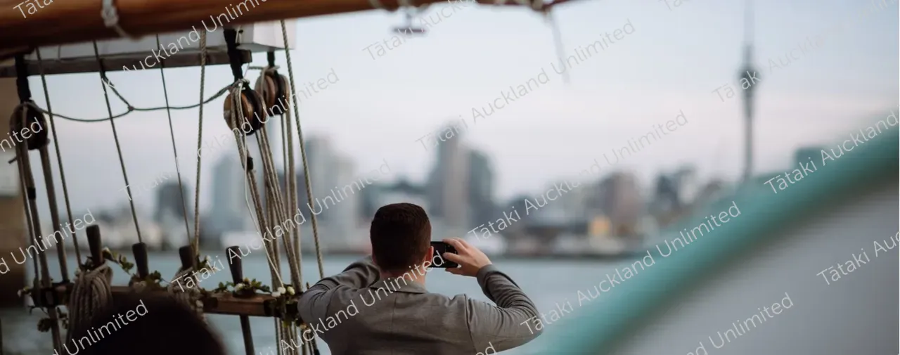 Sunset sailing on ted ashby with sky tower in background