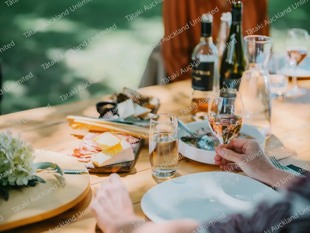 Business professionals dine outdoors at Waiheke vineyard 7