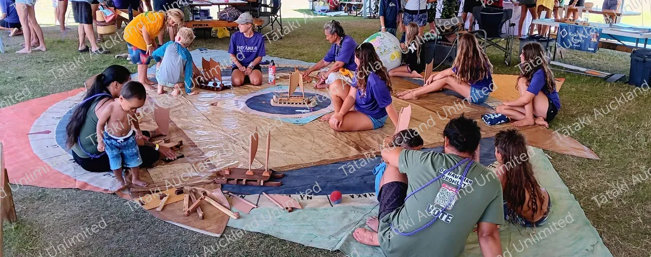 people sitting and creating waka