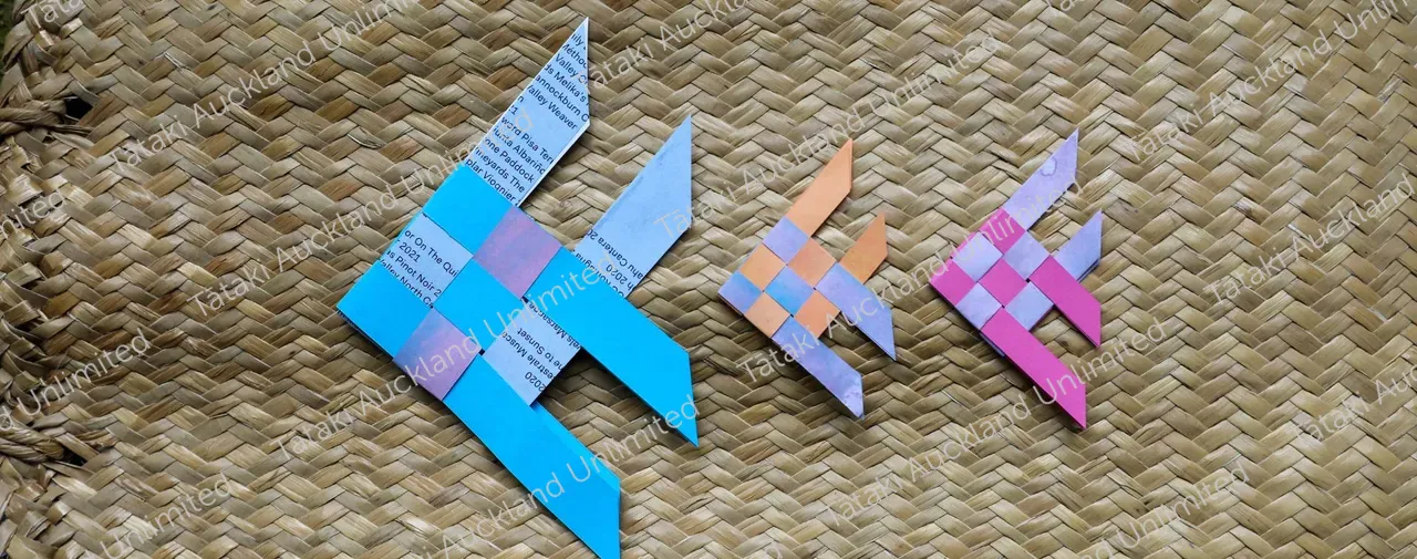 Woven paper fish on woven background