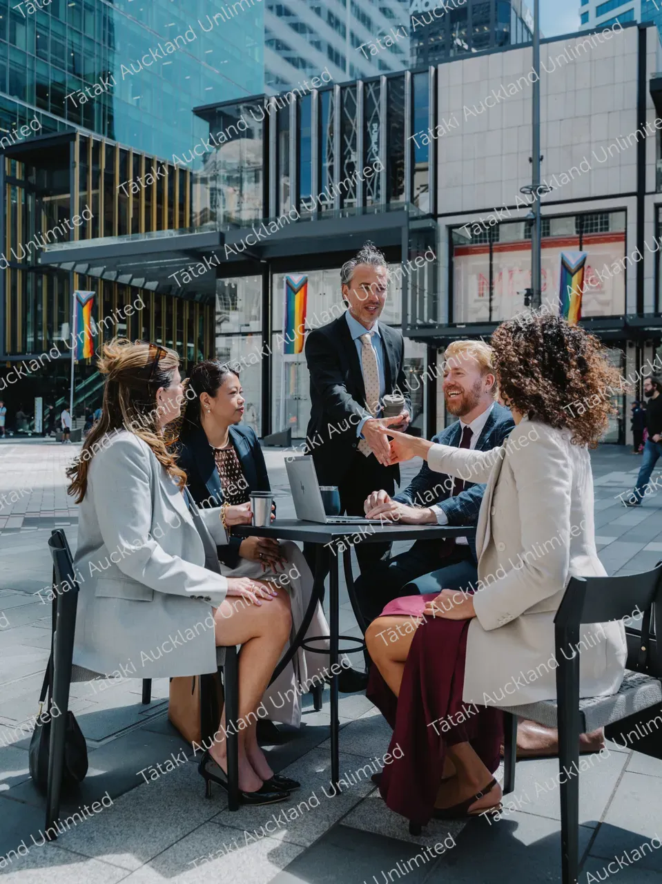 Outdoor business meeting with five professionals 4