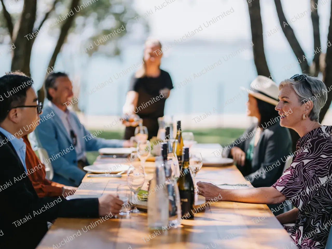 Business professionals dine outdoors at Waiheke vineyard 10