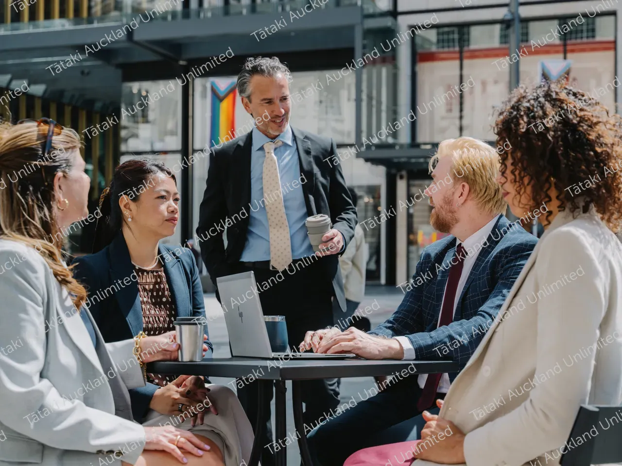 Outdoor business meeting with five professionals 2