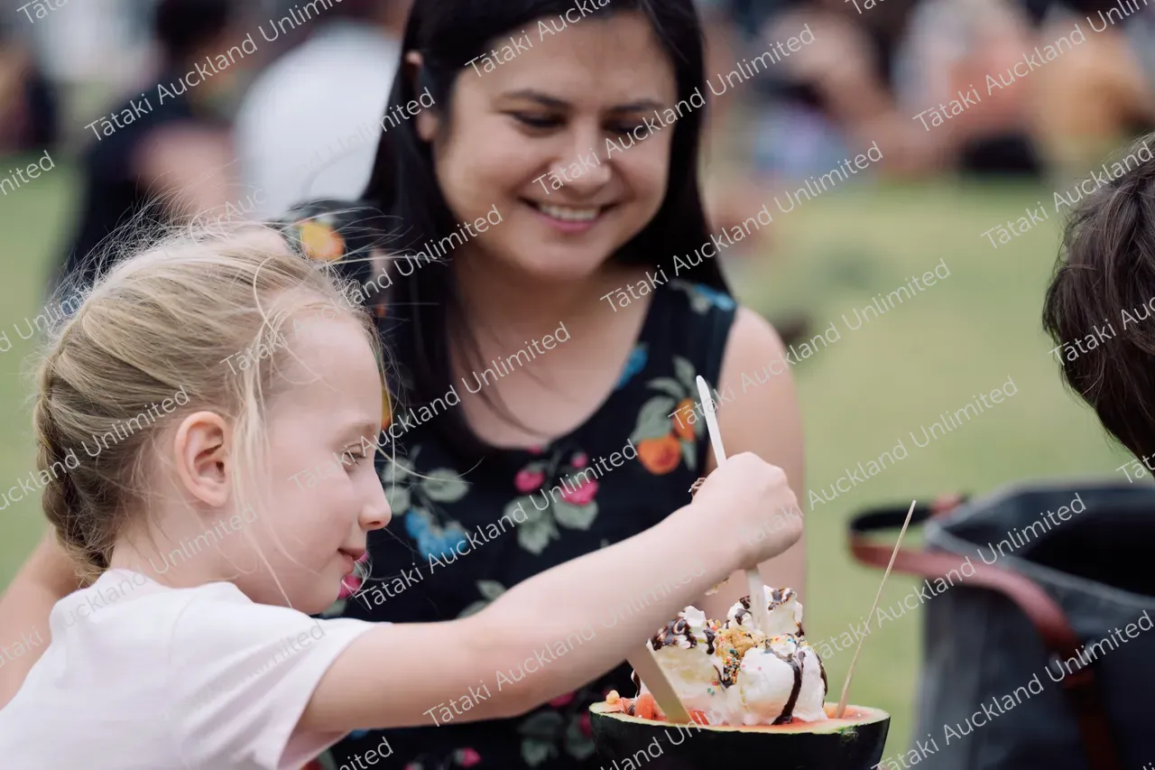Family enjoys ice cream at Pasifika Festival