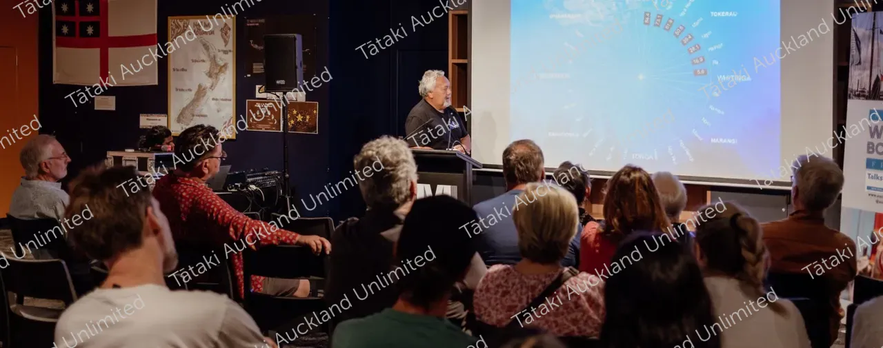 People sitting watching presentation at NZMM