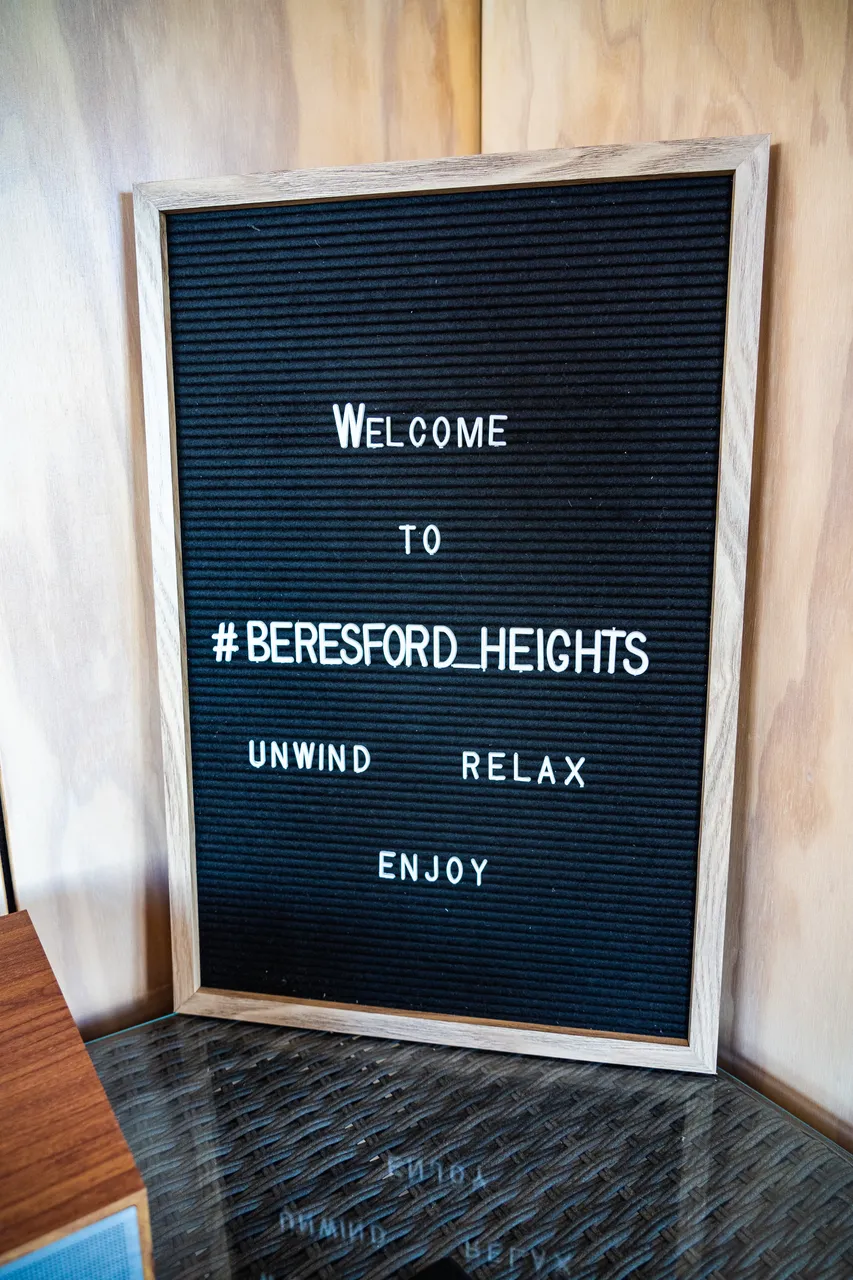 A welcome sign sitting on table