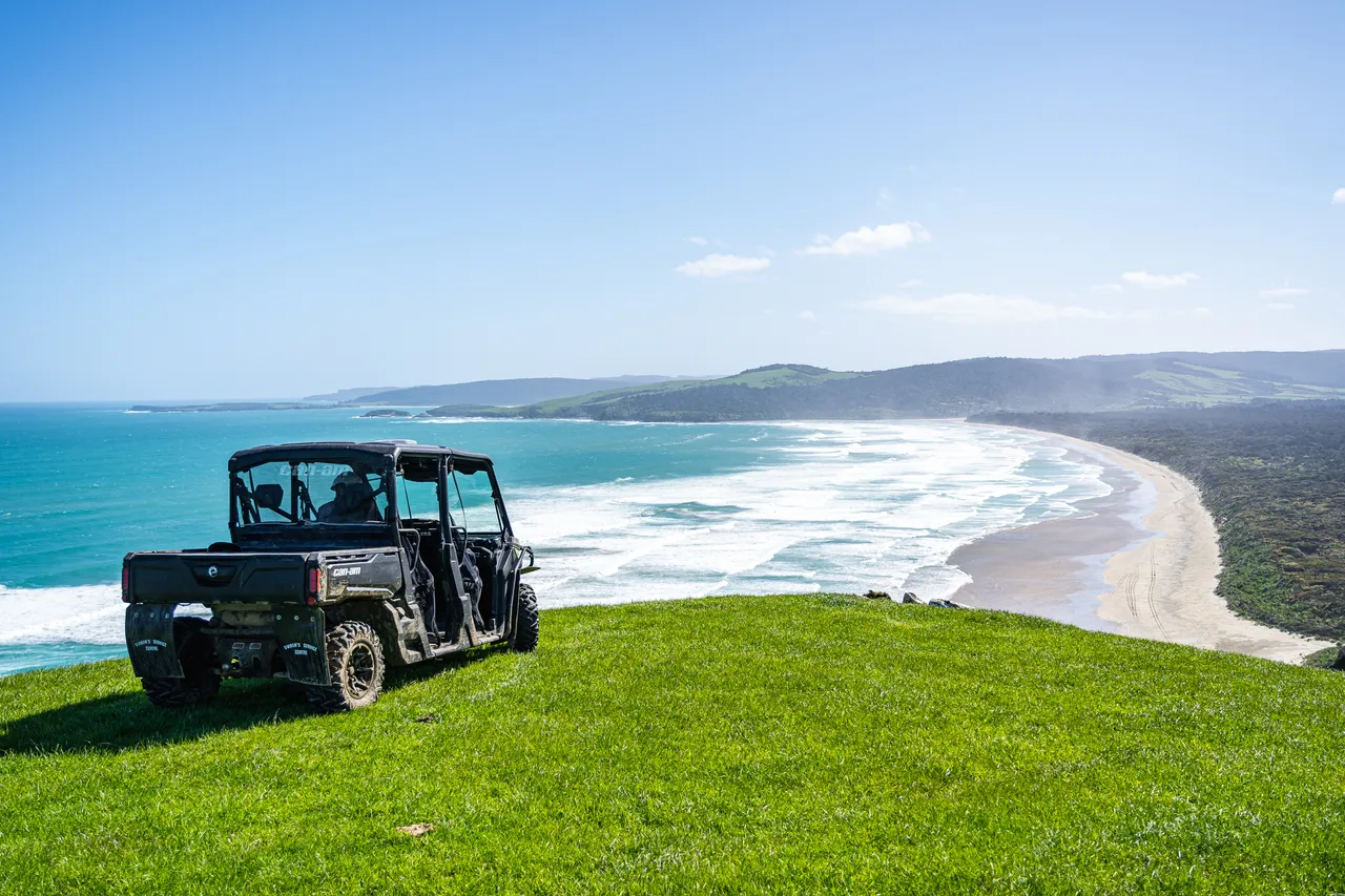 Side by side parked on grass overlooking the sea