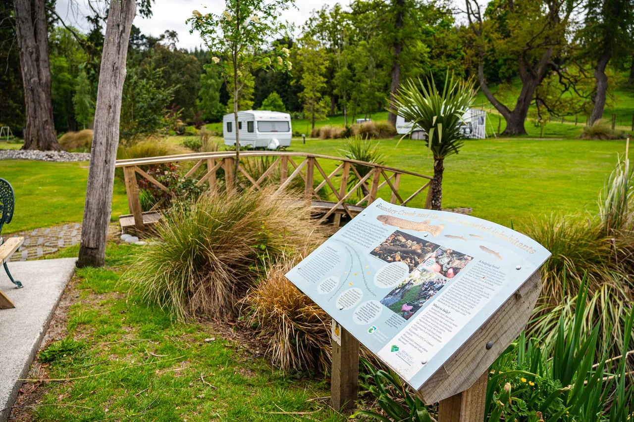 Information sign and wooden bridge