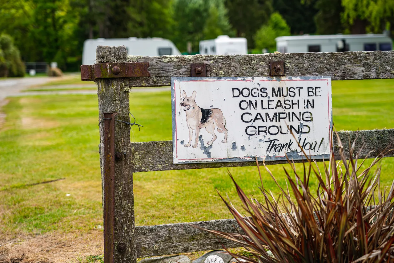 Sign on wooden fence