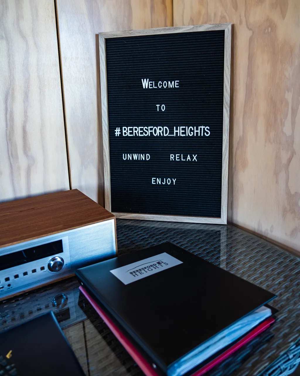 A welcome folder and sign sitting on a table