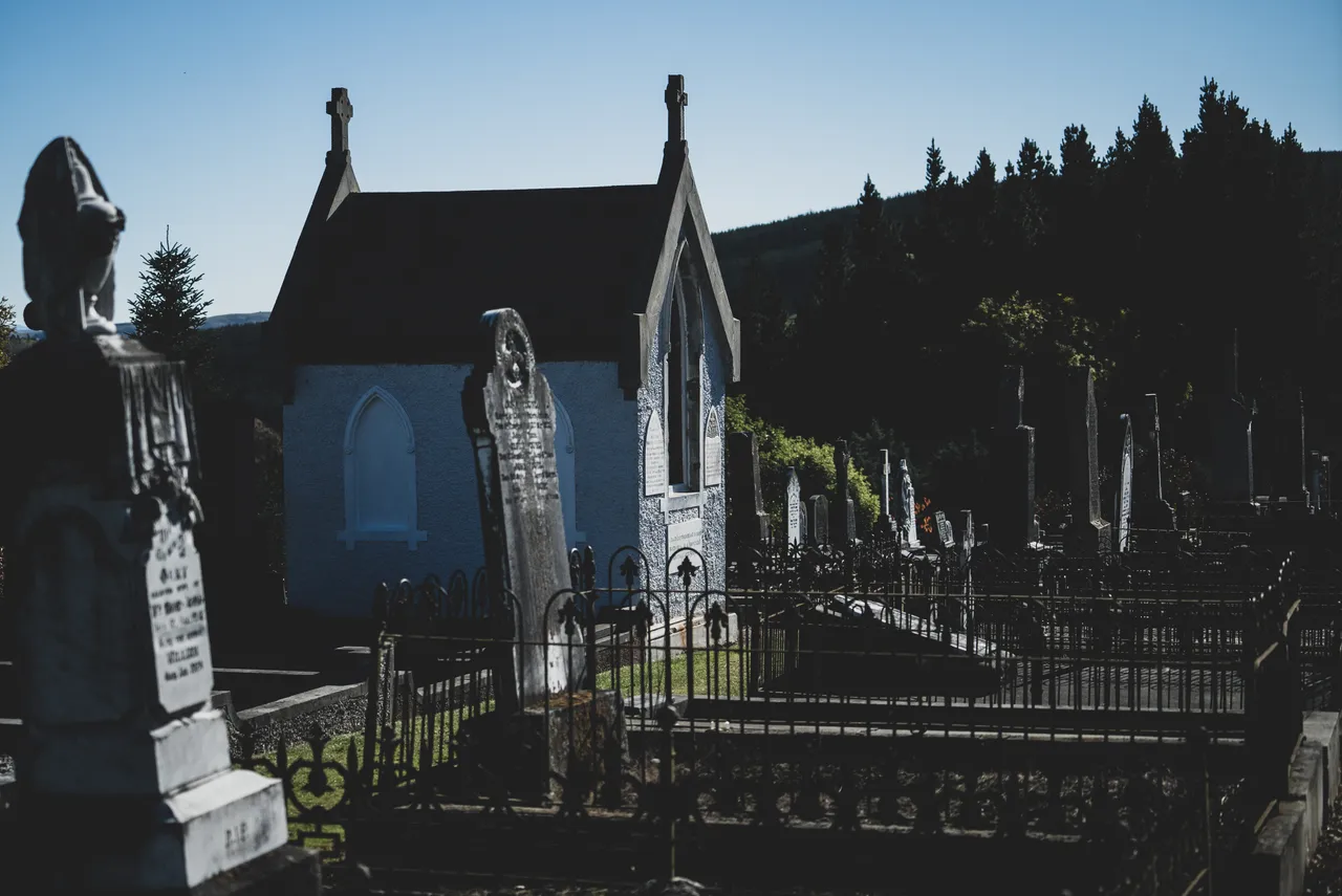 Headstones and fences and building