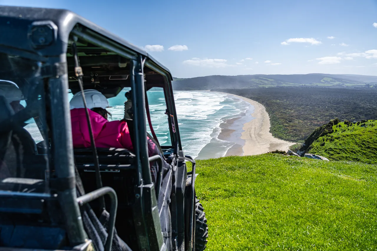 Side by side parked on grass overlooking the sea