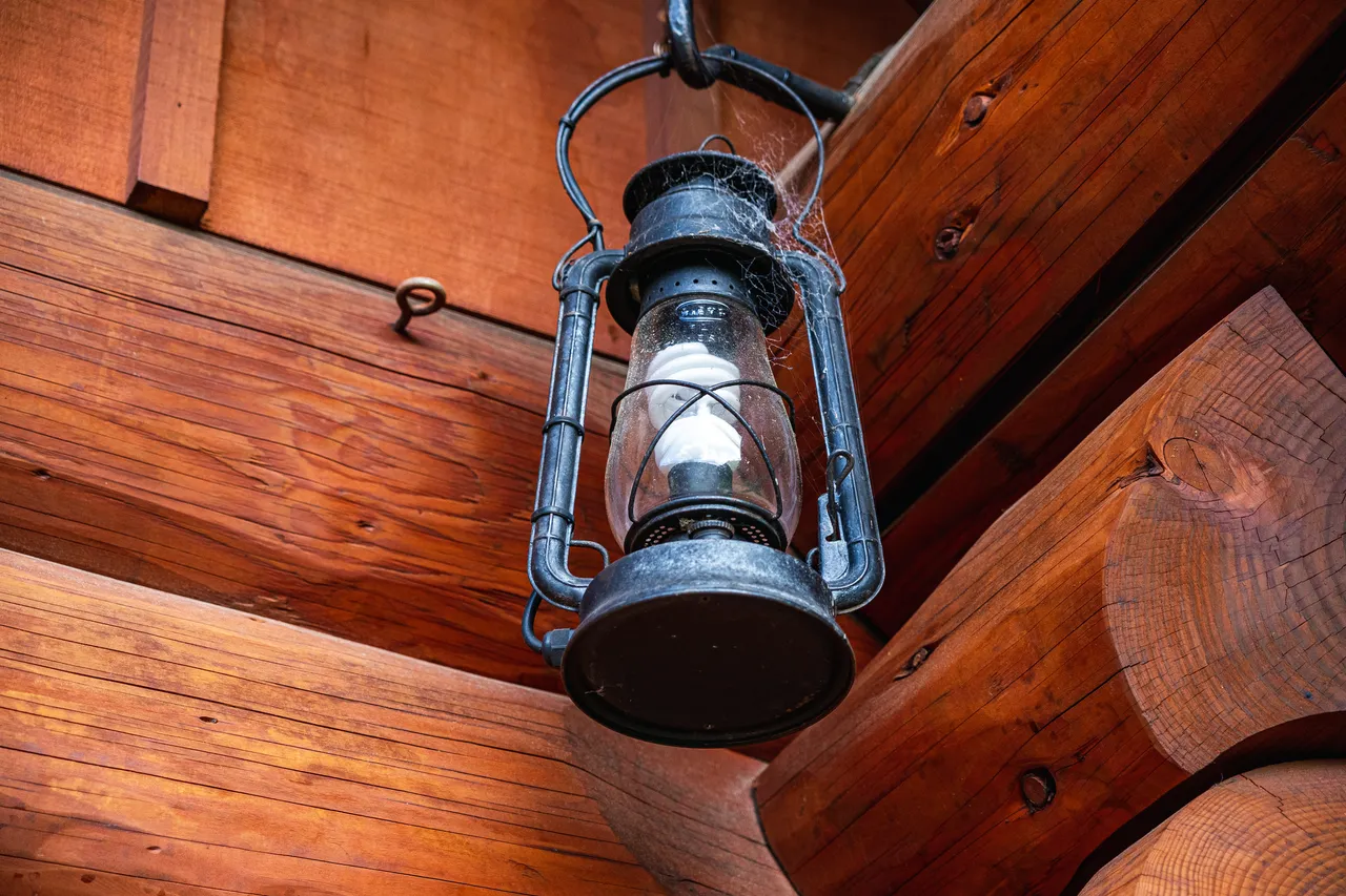 Details of log cabin and lamp