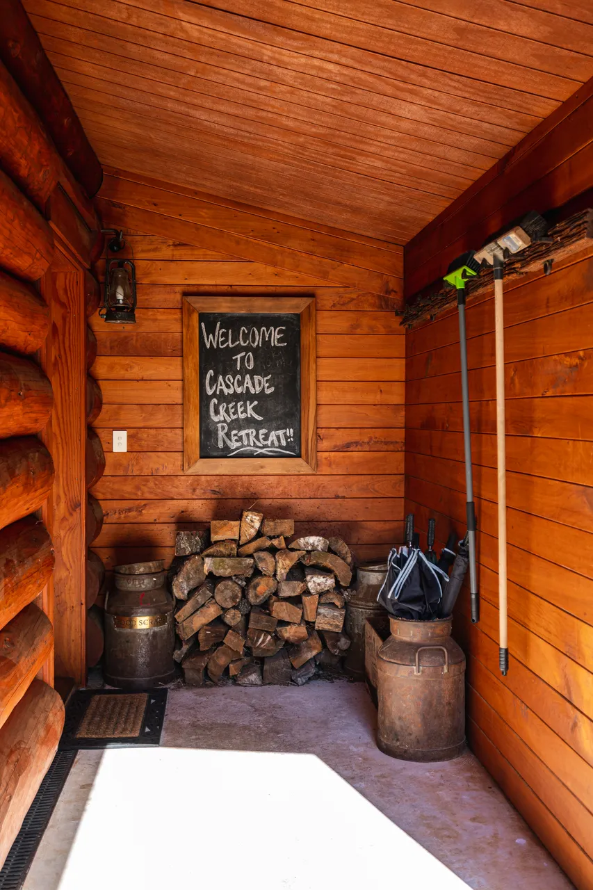 Welcome sign and firewood