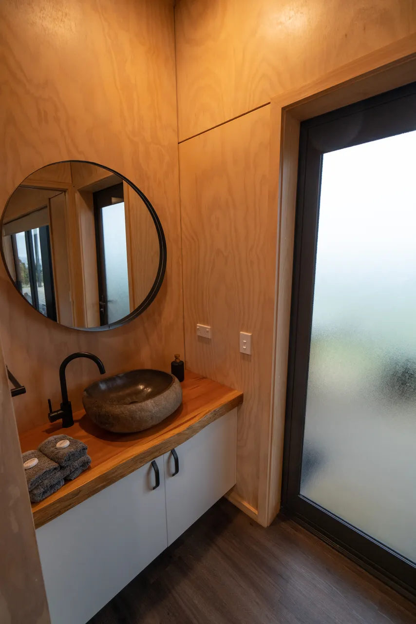 Wooden bathroom with mirror