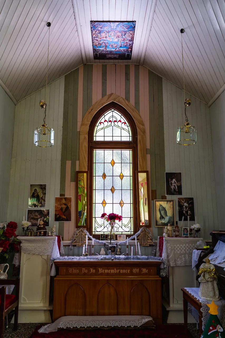 Stained glass window and candles