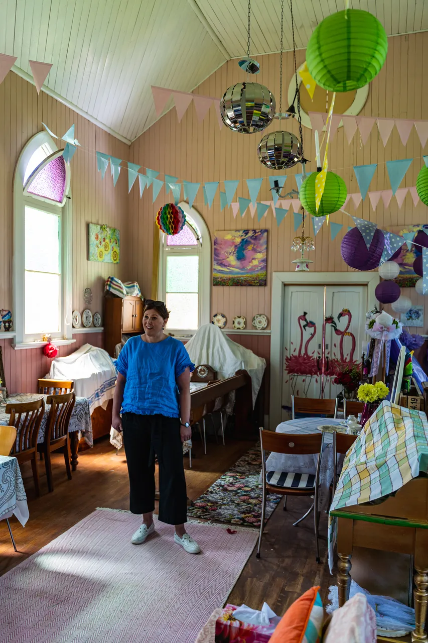 Melissa in room with tables and artwork