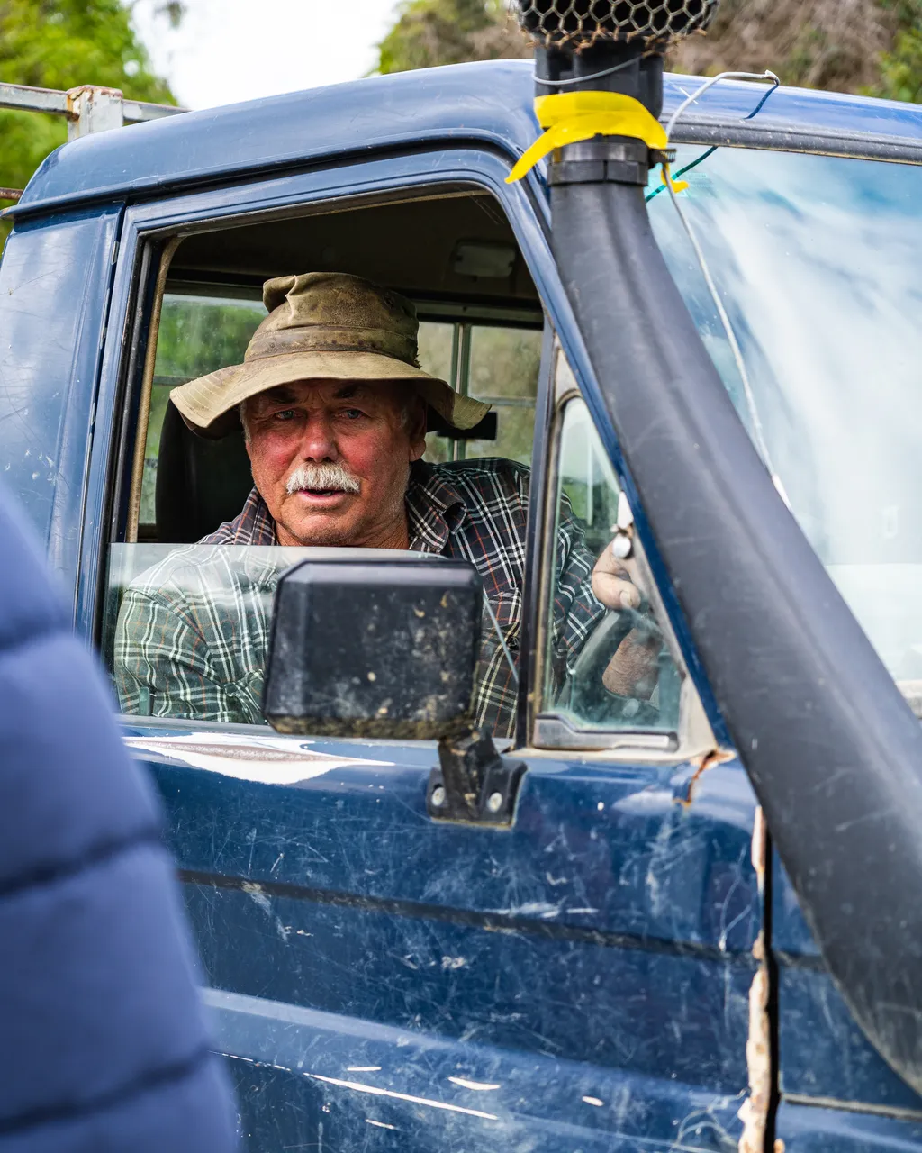 Man in blue truck