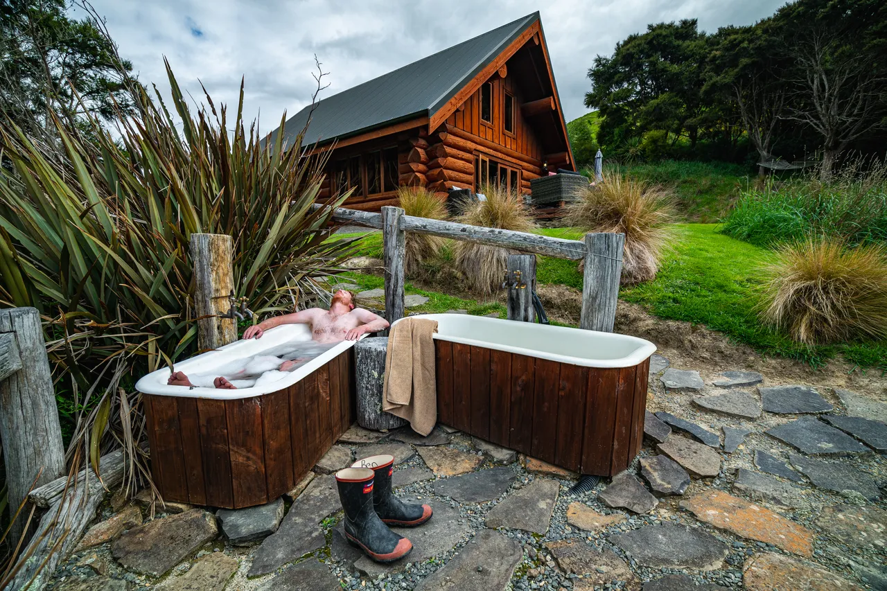 Person in bathtub outside