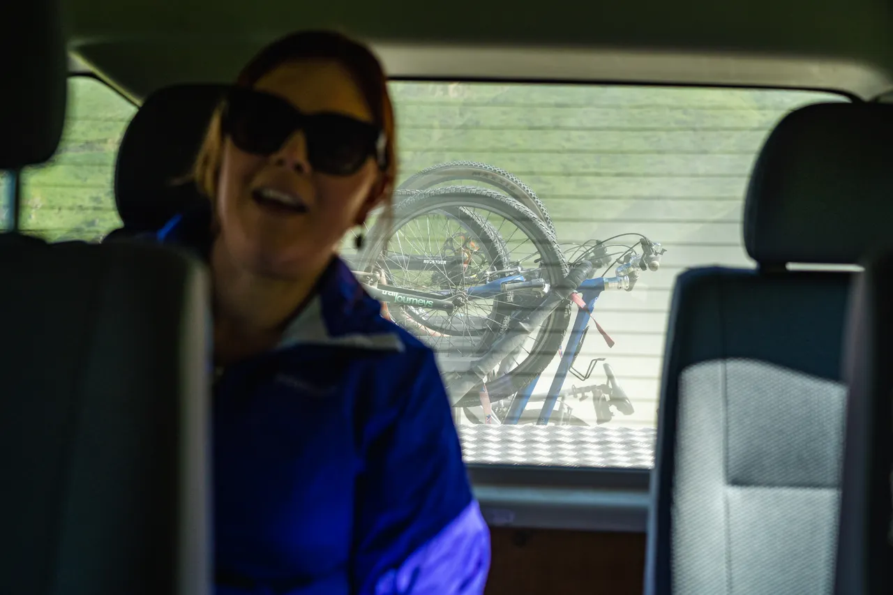 Bikes on bike rack behind van