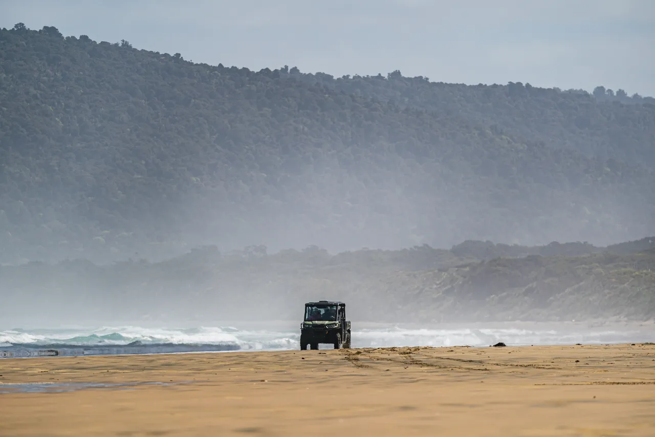 Side by side driving on beach