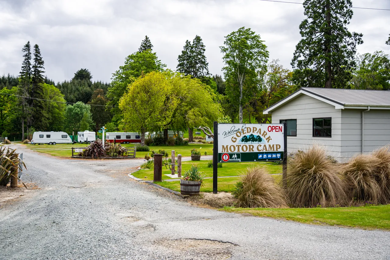 Welcome sign and driveway