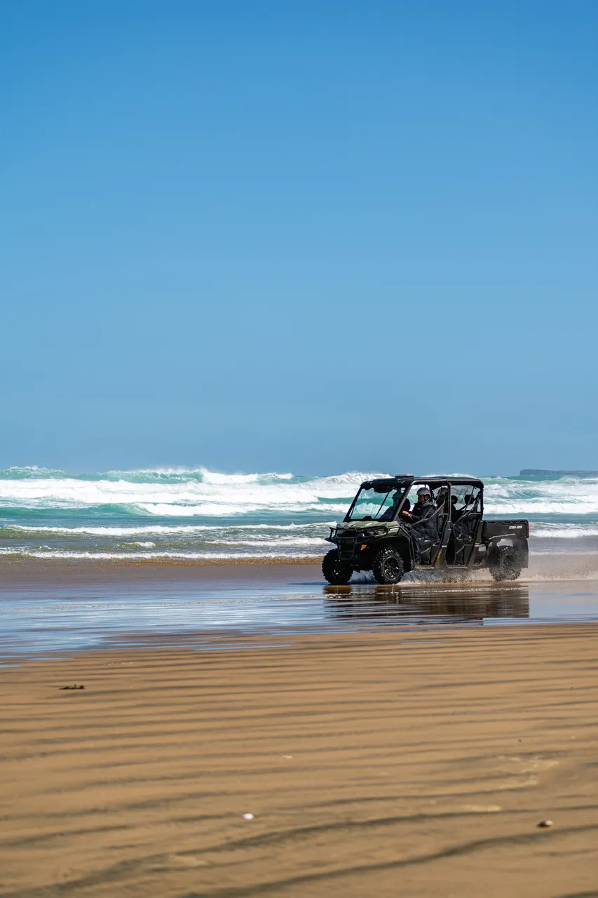 Side by side driving on beach