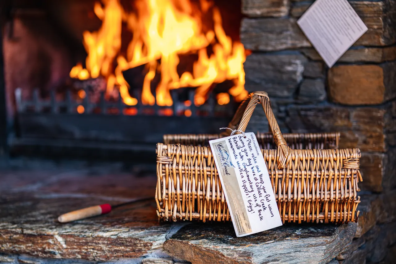 Basket beside fireplace